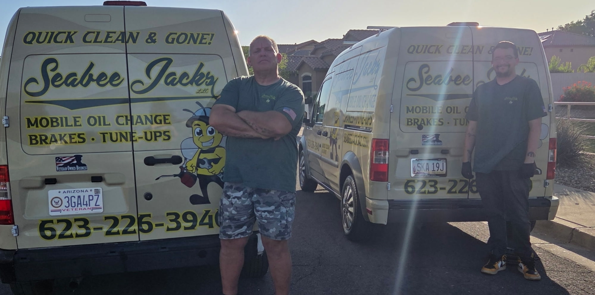 SeaBee Jack's family-operated team beside the branded service vans